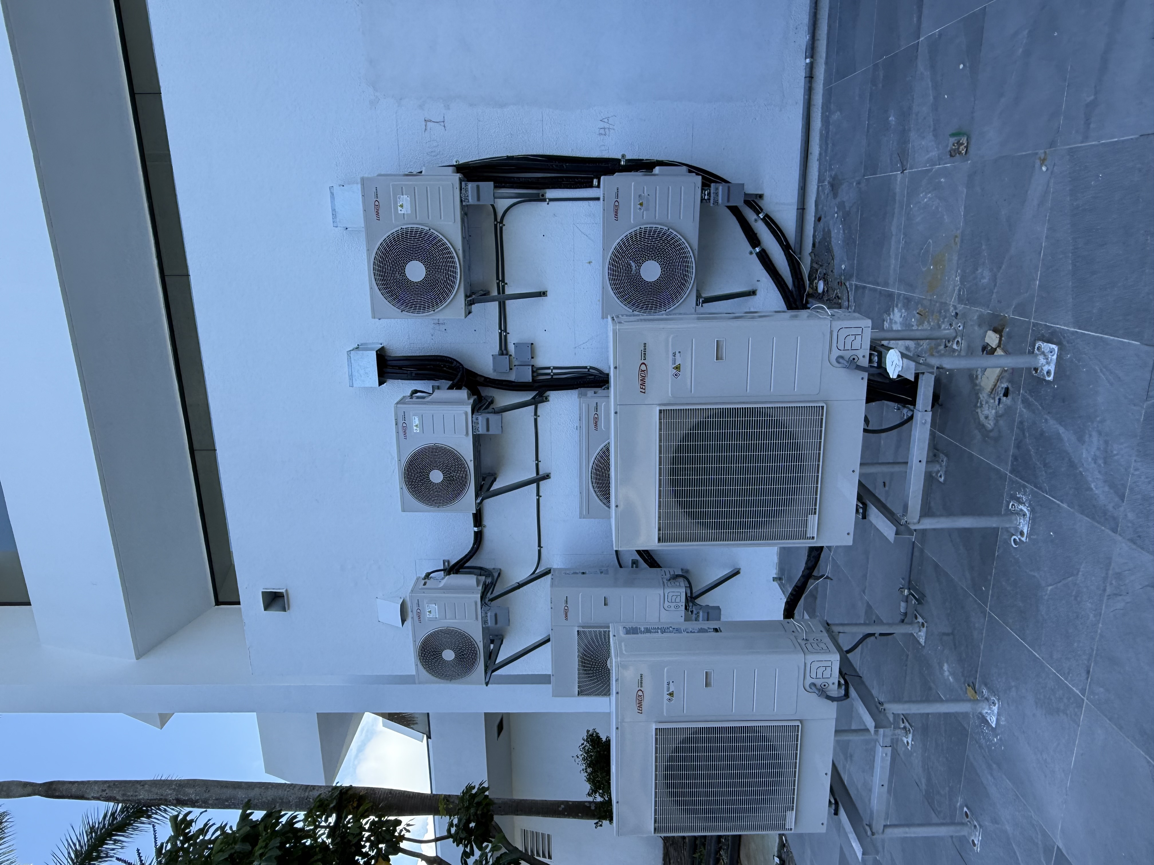 Bank of ductless condensing units installed at a coastal property
